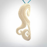 This is a beautiful hand carved octopus tentacle pendant. It is a wonderfully detailed pendant that we have carved in natural, untreated bone. We provide this with a paradise blue coloured adjustable cord and shipping is included worldwide.